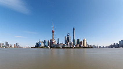 Fototapeta premium beautiful Shanghai Lujiazui Cityscape with blue sky background viewed from the bund.