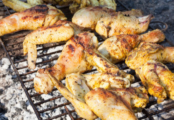 Chicken legs and wings on the grill