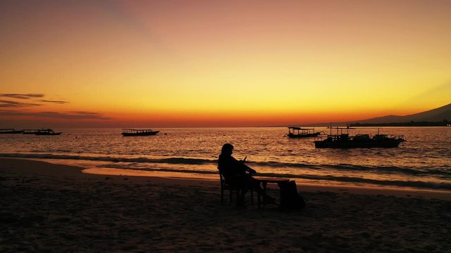 Tourist Sitting On the Chair in the Maldives Enjoying The Beautiful Scenery Of A Sunset  - Wide Shot