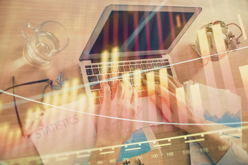 Multi exposure of forex graph with man working on computer on background. Concept of market analysis.