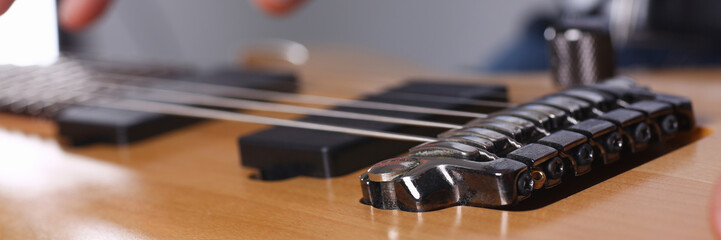 Male arms playing classic shape electric guitar