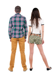Back view of couple. beautiful friendly girl and guy together.