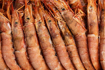 Background of frozen big shrimps closeup, sea food.