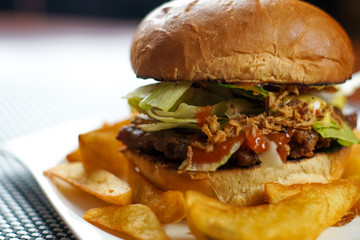 Hamburger and fries on a table