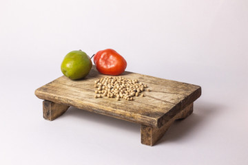 fresh rocoto chili ​​on a wooden board , copy space 