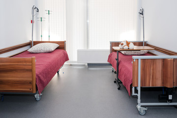 Clean empty hospital room ready for patients. Empty beds in hospital ward