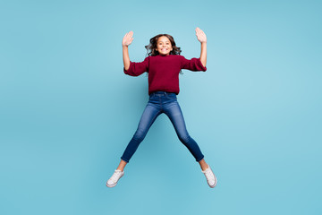 Obraz premium Full length body size photo of white cheerful preteen jumping up shaping star smiling toothily isolated vivid color background