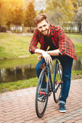 Fototapeta na wymiar Handsome Young Man With Bicycle