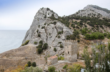 Mountain landscape, a small chapel by the mountain by the sea. View from the old fortress.