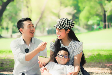 Obraz premium Family.Happy family having fun in the park.