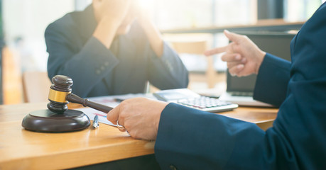 Business people feel sad when accused of bankruptcy.