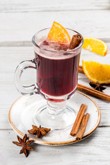 Mulled wine in a transparent glass goblet