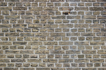 Dirty rough yellow brick wall pattern background with a lot of detail