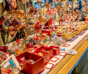  Selective focus on Christmas decorations on sale from a street vendor at the 2019 Christmas market in York