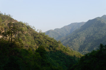 The view of mountain, blue sky, greenery, the beauty of nature of the famous neer waterfall, rishikesh, Uttarakhand, India.
