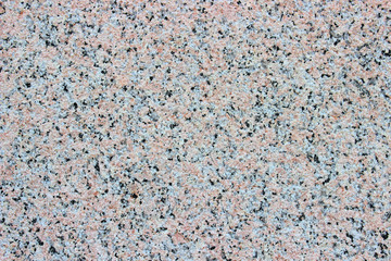 Multicolored granite wall background texture. Real natural marble stone. Mix of colors in the form of natural little stones.