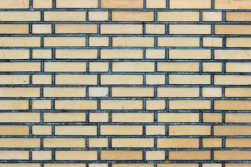 New light yellow brick wall background texture with various sizes bricks