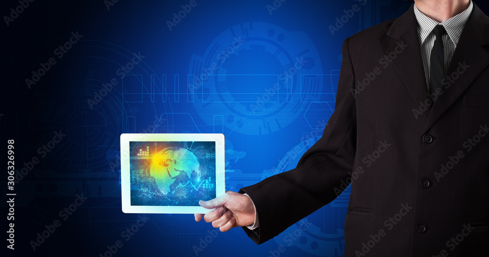 Wall mural Hand holding tablet with global database concept