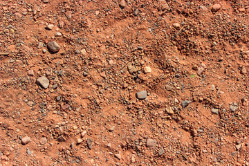Red Rock Canyon sand with little rocks background texture pattern