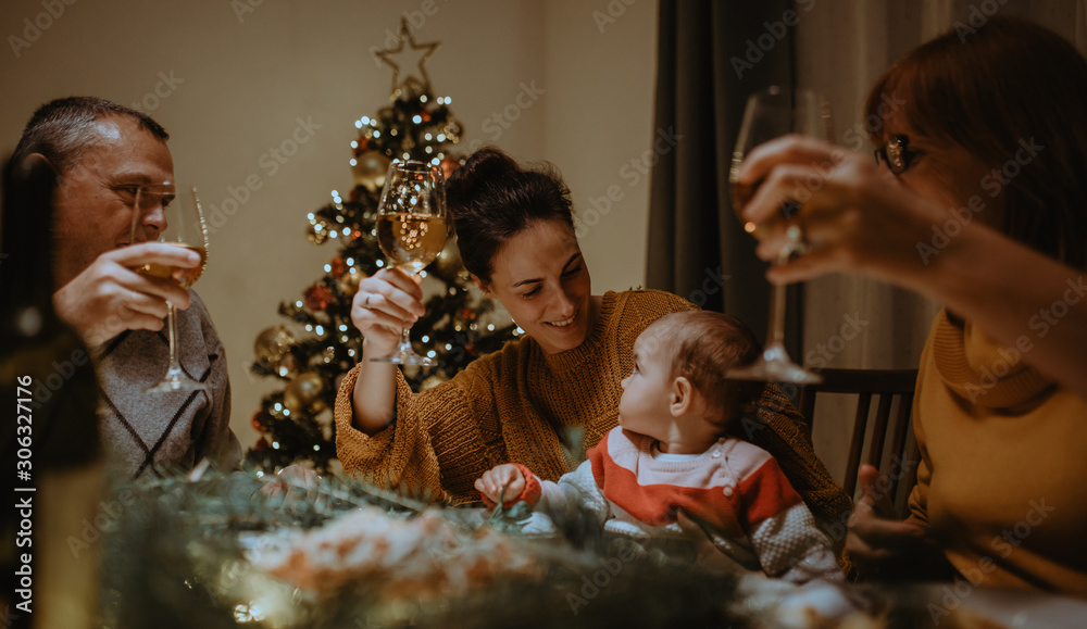 Wall mural Christmas family dinner. Baby's first Christmas with family