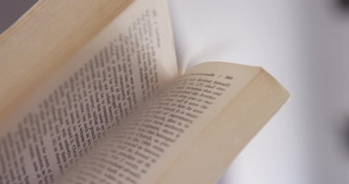 Close Up - An aging book's pages are flipped from cover to cover - shot on RED