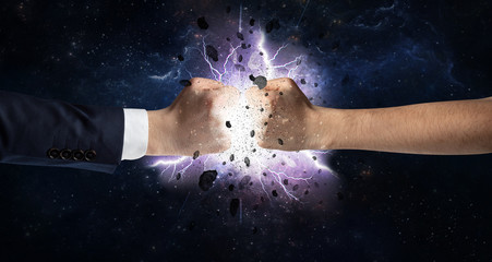 Naklejka na ściany i meble Two hands fighting with storm explosion concept