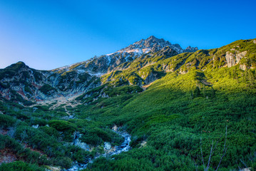 Gorgeous mountain in Tatras with river below it in autumn , Poland Bucinova straznica