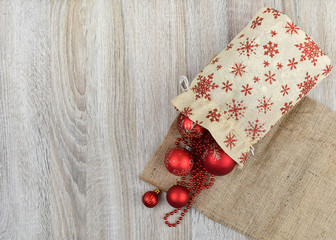 The concept of New Year's gifts. A wooden background. Place to sign. Card.