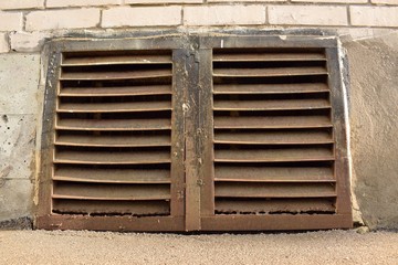 old ventilation window with traces of rust