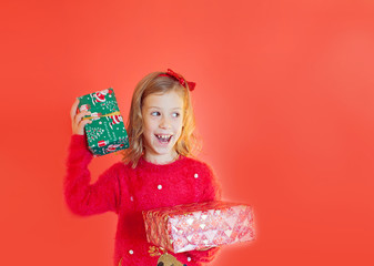 Happy girl  on the red background. Merry Christmas. Sale. Black Friday.