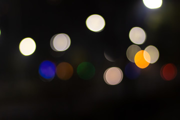 Blurred green blue yellow lights in the city