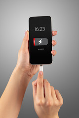 Elegant hand charging smartphone with low battery