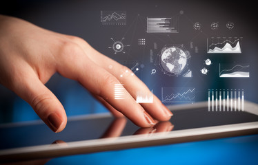 Hand holding tablet with global business concept