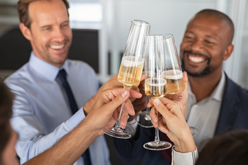 Business people raising toast at office