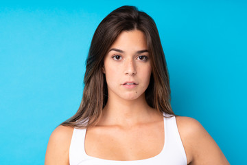 Fototapeta na wymiar Portrait of pretty teenager Brazilian girl over isolated background