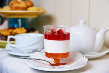 Strawberry dessert on a saucer with lace.