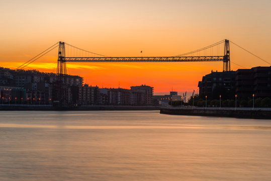 Panorama of Portugalete and Getxo with Hanging Bridge of Bizkaia at dusk from La Benedicta pier, Basque Country, Spain