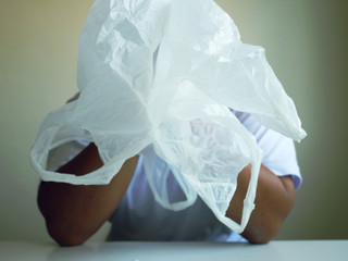 Close up a man holding white plastic bag recycle.