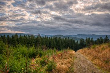 hiking trail in mountains with beautiful sky