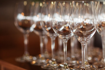 Glass glasses displayed in a row. Restaurant. Bar. Celebration