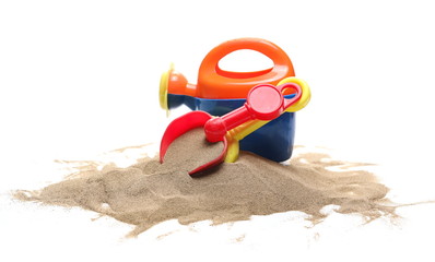 Plastic beach, garden toys for kids in sand pile, isolated on white background