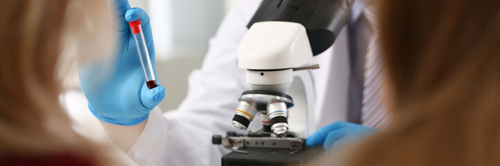 Male hand in blue protective gloves holding