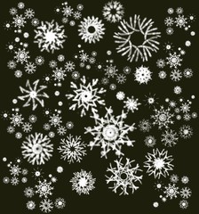 Snowflakes on a black background. Abstract texture. Delicate background for printing on wrapping paper, postcards, scrubbing, wallpaper, packaging. Winter holiday snow background. Christmas abstract b