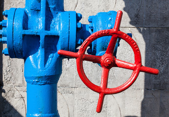 Red valve on the blue pipe.