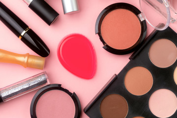 professional cosmetics on pink background. Flat lay, make-up background. cosmetic products