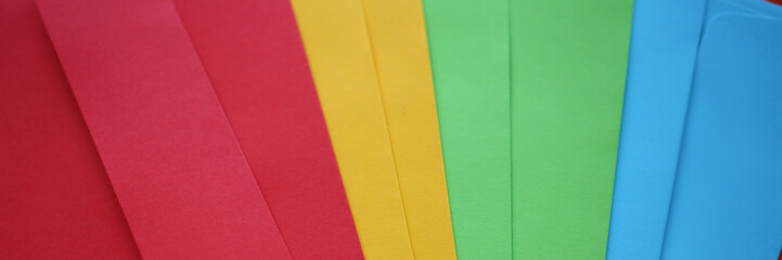 Set of colourful envelopes lying in fantail shape