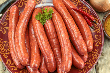 several raw merguez on a plate