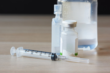 A needle and syringe, antibiotic powder, saline solution for treatment of bacterial infection