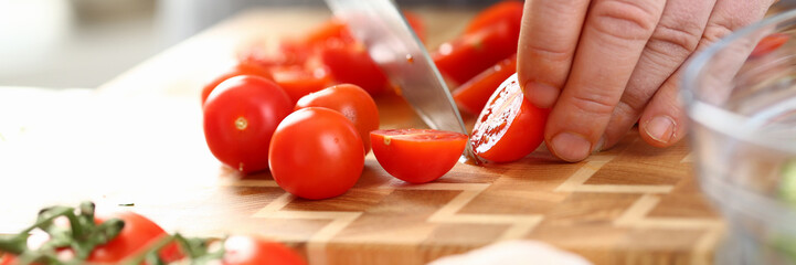Male Hands Slicing Ripe Cherry Tomato Ingredient
