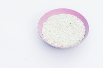 Fototapeta na wymiar Raw dry rice in separate bowls on a white background